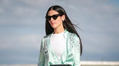 Jeans have become a fashion staple, even in dressed-up looks, as demonstrated by this street style during the recent Paris couture fashion week. Edward Berthelot / Getty Images
