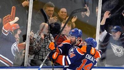 Oilers’ Sam Gagner, left, scored four goals and provided four assists against Chicago.
