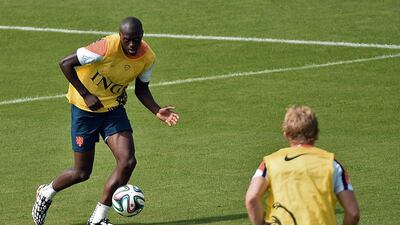 Netherlands defender Bruno Martins Indi, left, attends a training session at Flamengo Stadium in Rio de Janeiro on June 26, 2014. Damien Meyer / AFP