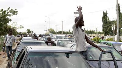 A motorist’s patience is tested as he waits to refill his car at a petrol station. Afolabi Sotunde / Reuters