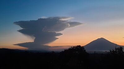 A mushroom-shaped ash cloud could be seen from 90 to 150km away. The eruption took place in Indonesia's East Nusa Tenggara province. AP