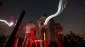 People gather to watch the Perseids meteor shower at Al Khatim Desert in Abu Dhabi, United Arab Emirates. The Dubai Astronomy Group organized the overnight event, which included a talk about the Perseids, a sky-mapping session, a question-and-answer session and telescope observations. EPA