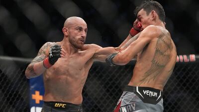 Alexander Volkanovski lands a punch on Max Holloway during their fight at UFC 276. Reuters