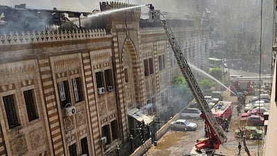 Firefighters put out the blaze at Egypt's Ministry of Religious Endowment in central Cairo on Saturday. Reuters