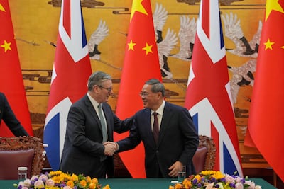 Keir Starmer and Chinese Premier Li Qiang shake hands after a signing ceremony in the Great Hall of the People in Beijing on Thursday. Reuters