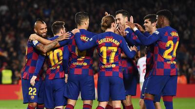 Messi and his Barca team-mates celebrate the fifth goal. Getty