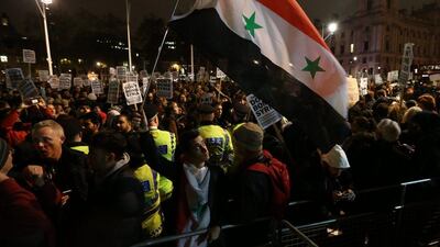 Demonstrators protest against British air strikes against Islamic State targets in Syria outside Parliament in London. Members of Parliament voted by 397 to 223 to authorise United Kingdom air strikes against ISIL in Syria after a 10-hour Commons debate. Carl Court / Getty Images