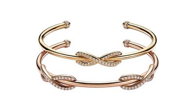Tiffany Infinity cuffs in 18 carat yellow and rose gold with round brilliant diamonds. Courtesy Tiffany & Co
