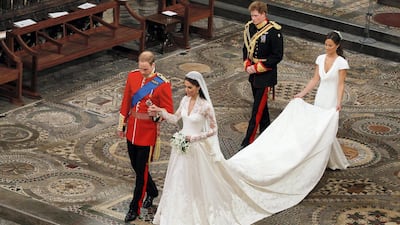 Prince William takes the hand of his bride Kate Middleton as they walk down the aisle inside Westminster Abbey in 2011. Getty Images