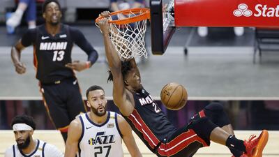 Miami Heat's Jimmy Butle dunks against the Utah Jazz during the NBA clash at American Airlines Arena in Florida on Friday, February 26. Miami won the match 124-116. AFP