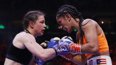 Katie Taylor trades punches with Amanda Serrano. Getty
