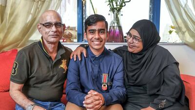 Abdul Muqeet with his parents, Abdul Sr and Andaleeb. Victor Besa / The National