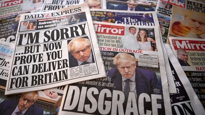 The UK newspaper front pages in London this week. EPA