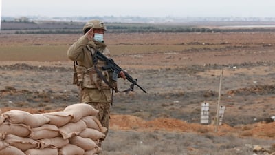 Jordanian soldiers patrol along the border with Syria to prevent trafficking. AFP