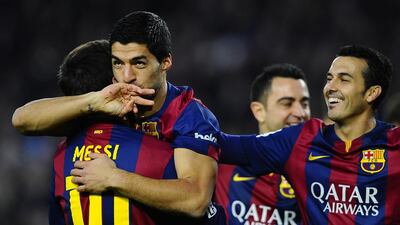 Barcelona’s Luis Suarez, centre, and Lionel Messi, left, hope to break their side's recent scoring void when they meet Manchester City on Tuesday. Manu Fernandez / AP Photo