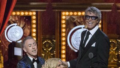 Hosts Alan Cumming and Kristin Chenoweth joke with actor Tommy Tune as he takes the stage to present the Best Direction of a Musical award. Tommy Tune received the Lifetime Achievement Award earlier during the show. Lucas Jackson / Reuters