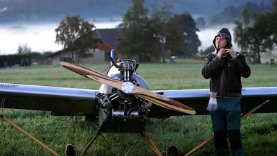 Mr Hadrava takes of his flying gear after a safe journey home and prepares to get Vampira back to her resting place. David W Cerny / Reuters