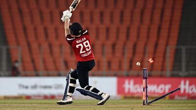England batsman Dawid Malan is clean bowled by India's Shardul Thakur for 68. AFP
