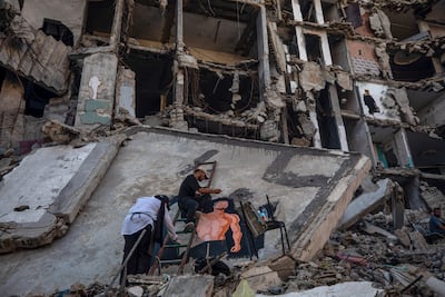 Anne Ridwan at work with other Palestinian artists. EPA