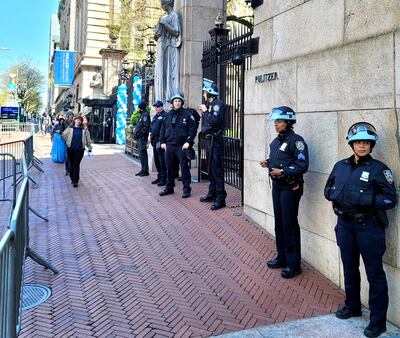 New York police guard a gate outside Columbia University on Monday after the campus was gripped by anti-Israel protests. Patrick deHahn / The National