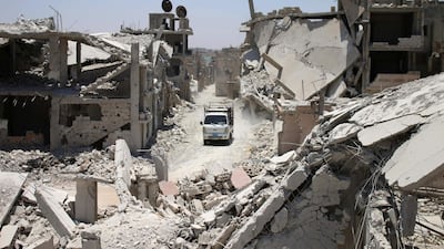 A truck drives down a destroyed street in a rebel-held area in Dara'a. Dara'a, in southern Syria, is one of the provinces in which sexual exploitation by aid distributors was reported. Mohamad Abazeed/ AFP