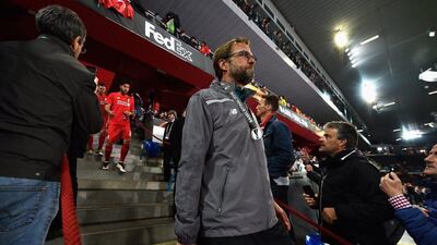Jurgen Klopp, manager of Liverpool, walks down the steps of the St Jakob Stadium after receiving a runners-up medal. Dennis Grombkowski / Getty Images)
