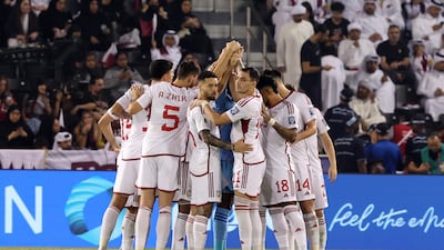 A UAE team huddle during their match against Qatar at Jassim Bin Hamed Stadium, Doha. The UAE lost 2-1 to leave their Fifa World Cup qualification in the balance. Chris Whiteoak / The National