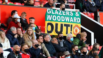 United fans with banner protesting against the club's owners and former executive vice-chairman at Old Trafford. PA