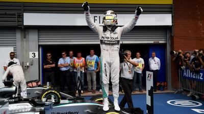 Lewis Hamilton of Mercedes celebrates outside the team garage on Sunday after winning the Belgian Grand Prix. Lars Baron / Getty Images