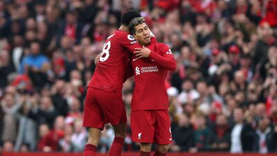 Liverpool's Roberto Firmino celebrates scoring their second goal with Cody Gakpo. Reuters