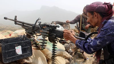 A Yemeni pro-government fighter fires a machinegun on the frontline of Kirsh between the province of Taez and Lahj, southwestern Yemen, on July 1, 2018. AFP Photo