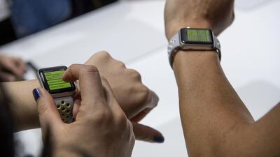 A new Apple Watch, without being tied to the iPhone, is said to be arriving this year as Apple meets with US mobile carriers. David Paul Morris / Bloomberg