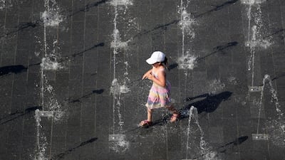 A child plays at a fountain in Duisburg, Germany. EPA