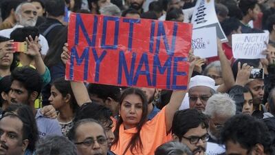 Bollywood actress Shabana Azmi holds up a placard during a protest in Mumbai against attacks by right-wing Hindu vigilantes, mostly on India’s Muslim minority, on June 28, 2017. Rafiq Maqbool / AP Photo