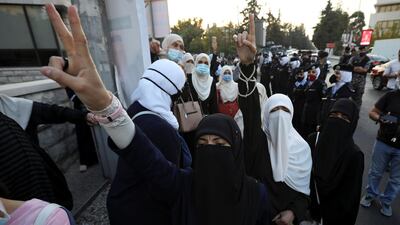 Jordanians gesture and chant slogans during a protest against cartoon publications of Prophet Mohammad in France and French President Emmanuel Macron's comments, near the French Embassy in Amman, Jordan. REUTERS