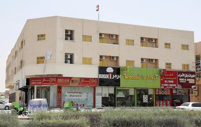 Food shops line Sheikh Ammar street in Al Muwaihat area in Ajman. Pawan Singh / The National