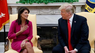 President Donald Trump meets with outgoing US Ambassador to the United Nations Nikki Haley in the Oval Office. AP