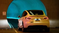 A Tesla Inc. electric vehicle drives through the Las Vegas Convention Center Loop ahead of the Consumer Electronics Show (CES) at the Las Vegas Convention Center in Las Vegas, Nevada on January 3, 2022. (Photo by Patrick T. FALLON / AFP)