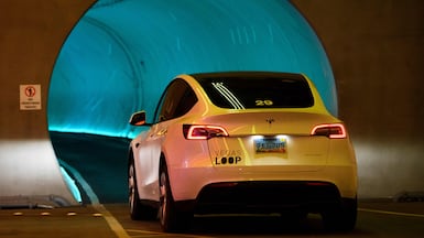 A Tesla Inc. electric vehicle drives through the Las Vegas Convention Center Loop ahead of the Consumer Electronics Show (CES) at the Las Vegas Convention Center in Las Vegas, Nevada on January 3, 2022. (Photo by Patrick T. FALLON / AFP)