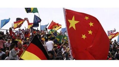 The flags were flying and fans cheering at the Chinese Grand Prix yesterday. But the colourful scenes are a far cry from downtown Shanghai.