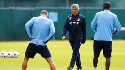 Manuel Pellegrini, centre, is likely to be without striker Sergio Aguero when Manchester City host Newcastle United on Monday. Paul Thomas / Getty Images