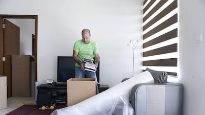 Rick McIntyre wrapped up his job as a teacher in Dubai on June 28, 2013 and started his first paid removal on July 18, 2013. Reem Mohammed / The National