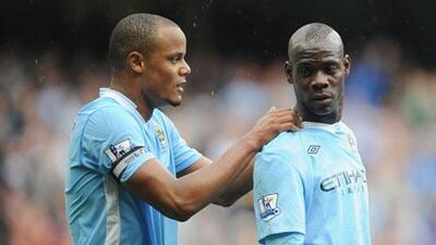 Vincent Kompany, left, talks with Mario Balotelli after the Italy striker had put Manchester City 1-0 up against Everton.