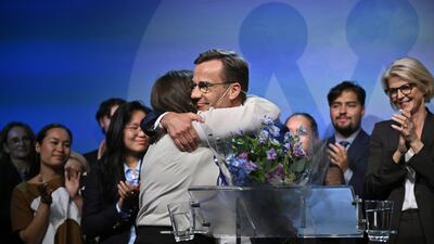 Ulf Kristersson, leader of the Moderate Party, centre, receives a hug during the party's election night event in Stockholm. Bloomberg