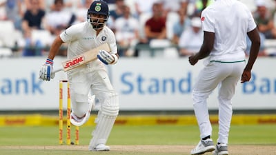 India captain Virat Kohli, left, insisted the selection for the Cape Town Test was based on form. Sumaya Hisham / Reuters