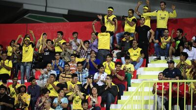 Sepahan fans cheer in Dubai during an Asian Champions League match against Al Ahli in 2014. (Sarah Dea/The National)