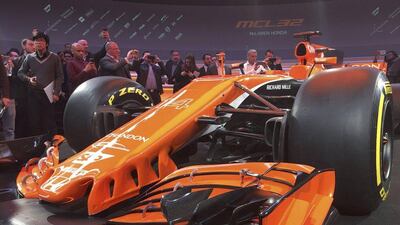 Journalists use their mobile phones to photograph McLaren's new MCL32 Formula One car at its launch in Woking, Britain, February 24, 2017. Alan Baldwin / Reuters