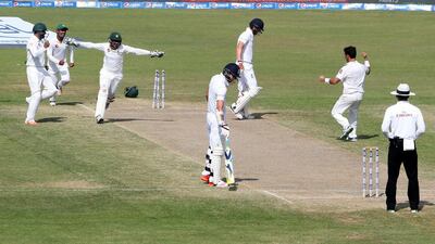 Pakistan players Yasir Shah, right, and Sarfraz Ahmed (arms outstretched) celebrate during their final Test victory over England in Sharjah last month. Jason O'Brien / Action Images / Reuters / November 5, 2015