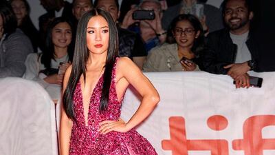 Actress Constance Wu arrives for the premiere of 'Hustlers' during the 2019 Toronto International Film Festival in a fuschia embellished mini dress by Georges Hobeika. Supplied