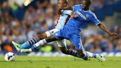 Chelsea's Ramires, right, vies for the ball with Aston Villa's Fabian Delph. Kirsty Wigglesworth / AP Photo